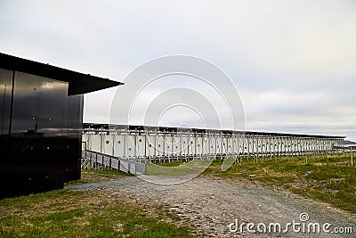 Vardo, Norway - 23 June 2019: Black kube building which is memorial devoted to memory innocently killed during witch hunting. Editorial Stock Photo