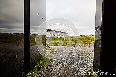 Vardo, Norway - 23 June 2019: Stylized bonfire and mirrors in a black cubic building with glass in the Museum a memorial dedicated Editorial Stock Photo