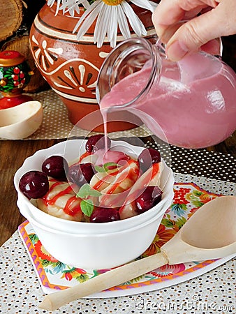 Vareniki with cherries and berry sauce Stock Photo
