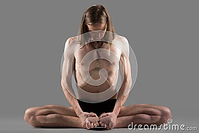 Variation of cobbler yoga pose Stock Photo