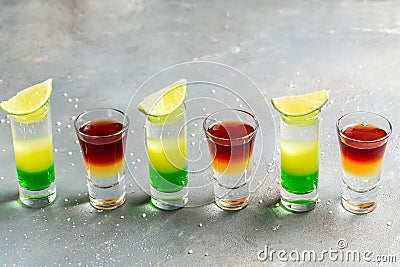 Variation of hard alcoholic shots. alcoholic cocktail drinks shot with lime Stock Photo