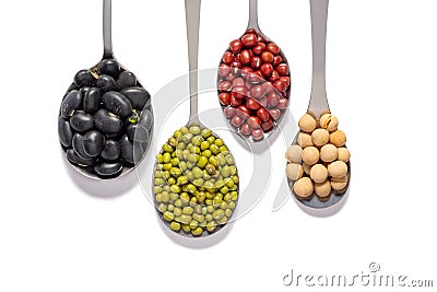 Varieties of beans in iron spoons Stock Photo