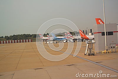A variety of aircraft awaiting passengers Editorial Stock Photo