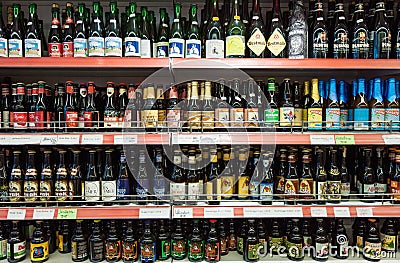 Variety of Belgian crafted beers on shop shelf display Editorial Stock Photo