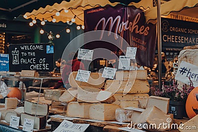 Variety of cheeses at the Palace of Cheese stand in Borough Market, London, UK Editorial Stock Photo