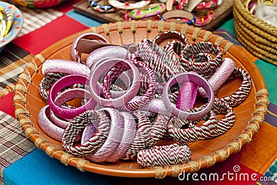 Variety colored handmade bangles are displayed Stock Photo