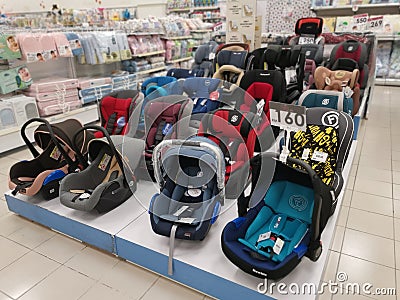 Variety of colorful baby carrier cot or basket is exhibited on display and sale Editorial Stock Photo