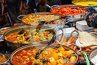 Variety of cooked curries on display at Camden Market in London Stock Photo