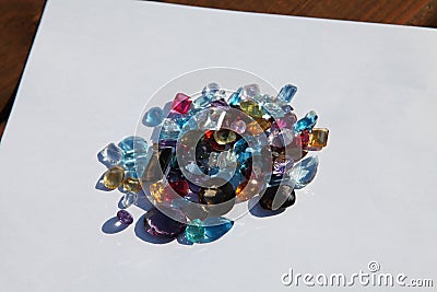 Cut gemstones piled on paper Stock Photo