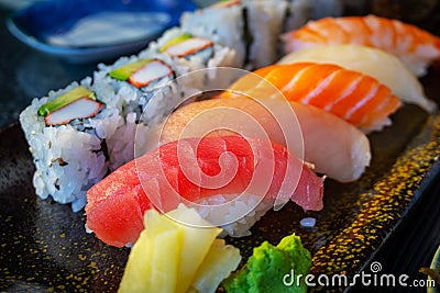 Variety of Delicious Nigiri Sushi Bento With California Roll Stock Photo