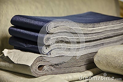 Variety of fabric materials one with a blue honeycomb pattern and a simple gray for the other Stock Photo