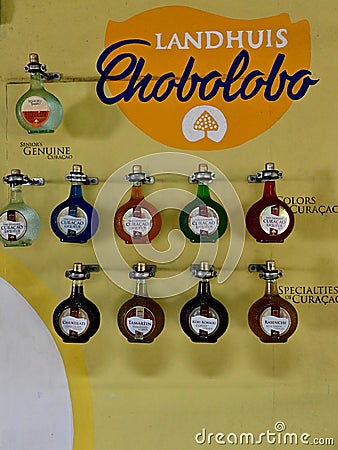 Genuine Curacao Liqueur Bottles Display on Wall at Landhuis Chobolobo Editorial Stock Photo