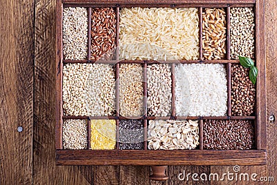 Variety of healthy grains and seeds in a wooden box Stock Photo