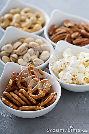 Variety of healthy snacks in white bowls Stock Photo