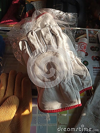 Heavy lather Hand gloves used in indian market Stock Photo