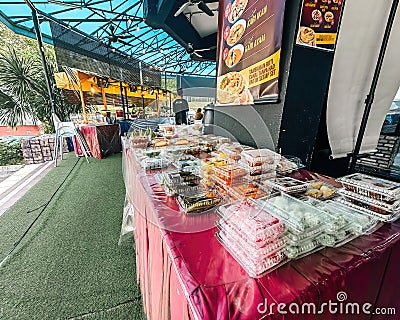 Variety of Malaysian local cakes or & x22;kueh& x22; sold at Ikhwan restaurant as breakfast takeaway Editorial Stock Photo