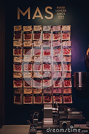 Variety of meat on sale at MAS stand inside Mercado de San Miguel, Madrid, Spain Editorial Stock Photo