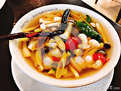 Variety mushrooms in spicy lemon grass soup. Stock Photo