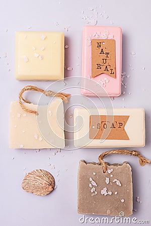 Variety of Natural Soaps on Blue Background Handmade Organic Soaps Vertical Flat Lay Stock Photo