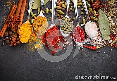 Variety of natural spices, seasonings and herbs in spoons Stock Photo