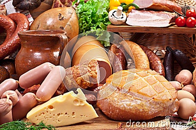 Variety of sausage products, cheese, eggs and vegetables. Stock Photo