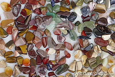 Pattern of small coloured semi-precious pebbles. Texture Stock Photo