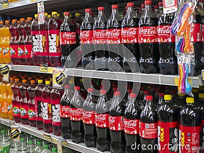 Variety of soft drinks, with various brands product in bottles on the shelves in a grocery store supermarket, in Yogyakarta, Editorial Stock Photo