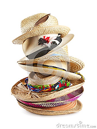 Variety of straw hats stacked vertically Stock Photo