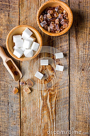 Variety of sugar in bowls on wooden table background top view space for text Stock Photo