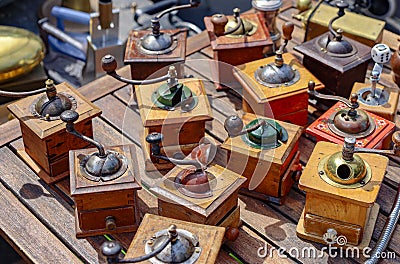 Variety of wooden antique coffee grinders from a Parisian flea market Editorial Stock Photo