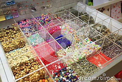 Various beads in boxes Stock Photo