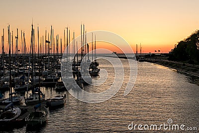 Sail yachts moored and a ship on the horizon. Stock Photo