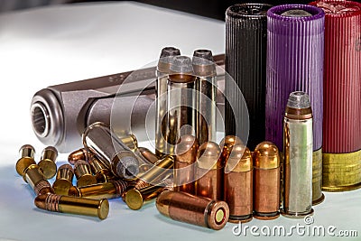 Various Bullets and Shells for Various Guns, With a Gun Stock Photo
