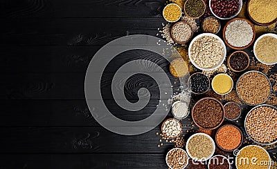 Cereals, grains, seeds and groats black wooden background Stock Photo