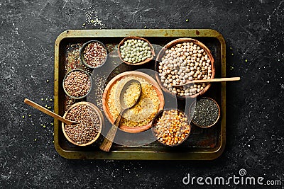 Various cereals and legumes: rice, peas, lentils, beans, mung beans, buckwheat, chia, corn and chickpeas. Stock Photo