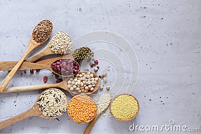 Various cereals in wooden spoons Stock Photo