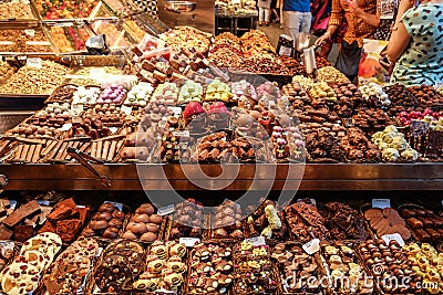 Various chocolate desserts for sale at a shop in the La Boqueria market. Stock Photo