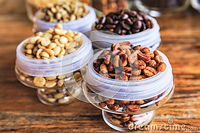 Various coffee beans on wooden background. Stock Photo