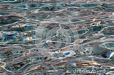 Various coins under water from the fountain as an offering Stock Photo