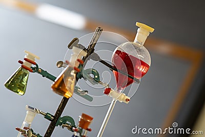 Various colored chemical solution inside flask into chemistry laboratory Stock Photo