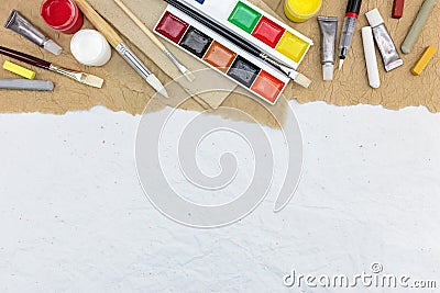 various colorful artistic drawing tools on recycled paper background Stock Photo