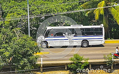 Various colorful buses bus in Puerto Escondido Mexico Editorial Stock Photo