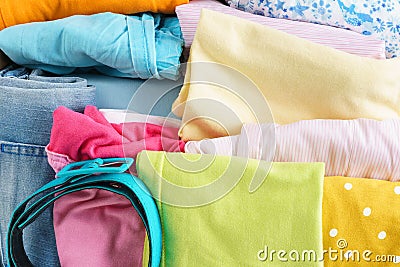 Various colorful clothes for children and teenagers Stock Photo