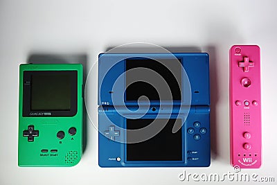 Various colorful Nintendo retro games. Portable Gameboy, DS and Wii controller. Editorial Stock Photo