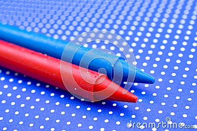 various colors crayons on a blue background Stock Photo