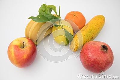 Various brightly coloured fruits against isolated white background. Stock Photo