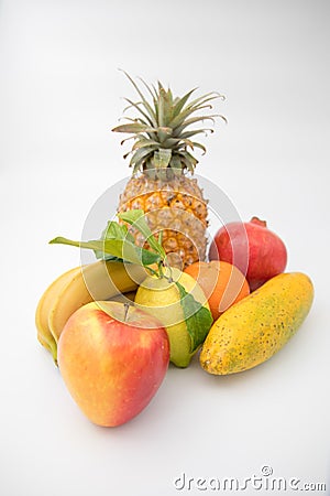 Various brightly coloured fruits against isolated white background. Stock Photo