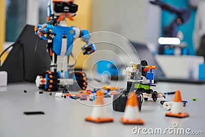 Various components and installations for robot fabrication fill the space, representing the intricate blend of Stock Photo