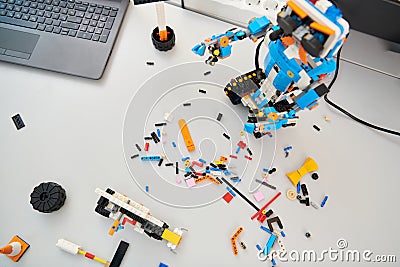 Various components and installations for robot fabrication fill the space, representing the intricate blend of Stock Photo