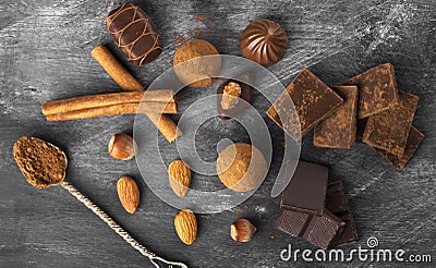 Various confectionery: chocolate, candies on a dark background Stock Photo